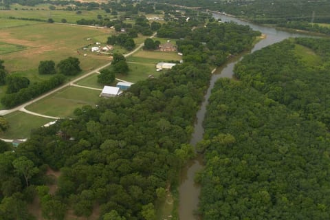 Immerse Yourself in Serenity: A Bird's Eye View of our Riverside Retreat on the Banks of the Brazos River