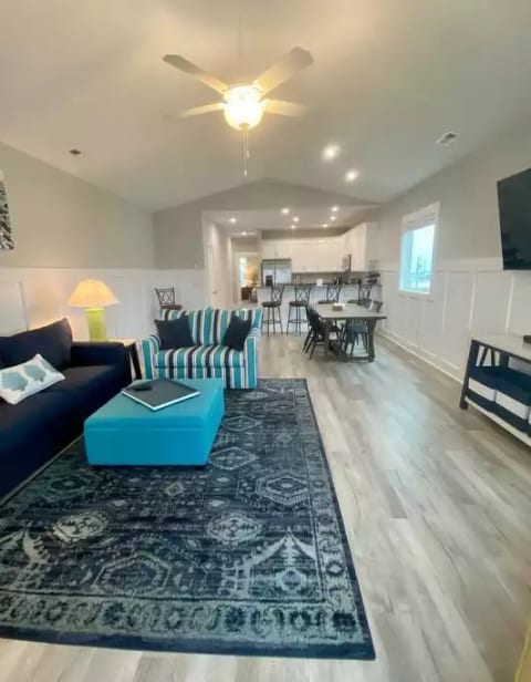 The open concept floor plan is never more inviting than it is here. Enjoy relaxing on designer furniture while taking in the water views or watching the game on the 65" TV. Or, bring out your best Gordon Ramsay and prepare the ultimate meal.