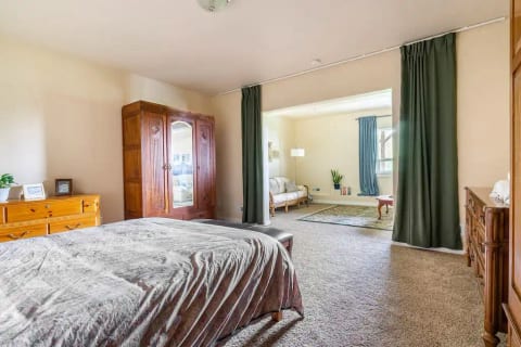The bedroom is enclosed with blackout curtains for restful sleep