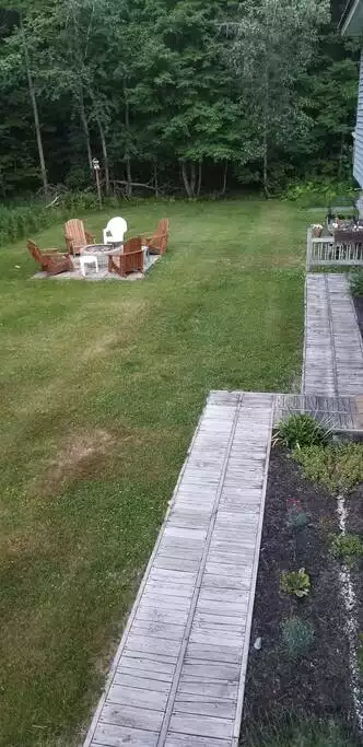 View of fire pit/yard from porch - Long Lake Escape, fun in all four seasons. - Bridgton