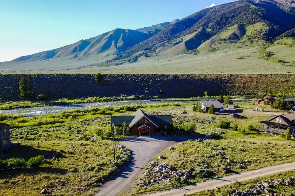 Aerial photo of the house. We do have neighbors but they are not close, our house is private inside, with trees and/or the river at every window.