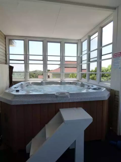 7 person hot tub on screened porch