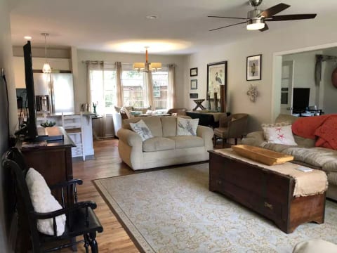 Large fold out sofa; drop leaf table for extra dining space; open-concept living room & kitchen