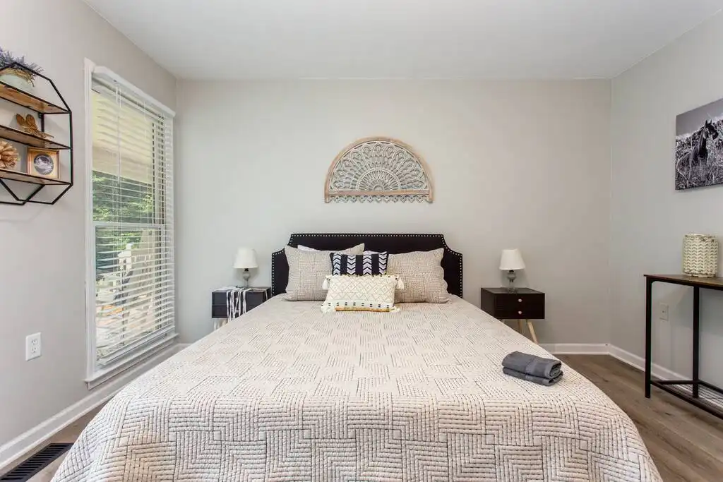 Secondary Bedroom with a view of the front porch and front yard. - Pink Door Farmhouse - Ellijay