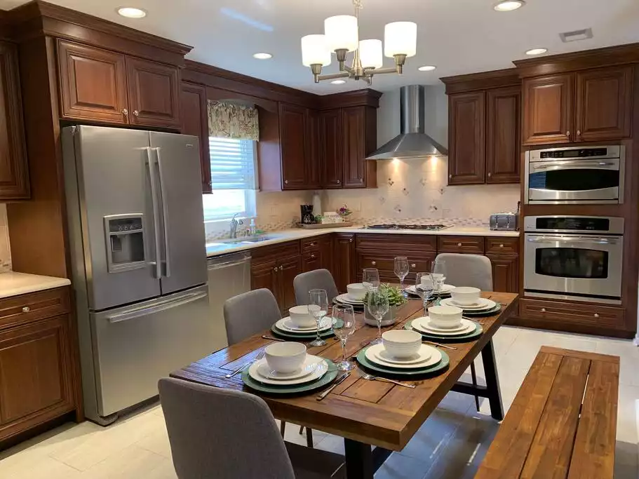 Beautiful kitchen featuring high end appliances. The kitchen is fully equipped for cooking and baking. Silverware for 8 guests, Cups, glasses, plates in different sizes, bowls, 4 bread toaster, coffee and espresso maker. Beautiful kitchen featuring high end appliances. The kitchen is fully equipped for cooking and baking. Silverware for 8 guests, Cups, glasses, plates in different sizes, bowls, 4 bread toaster, coffee and espresso maker. - Disney Area Boho Chic Villa - Kissimmee