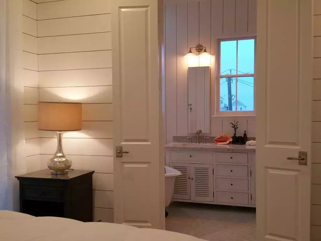 En Suite Master Bathroom with double sink vanity, claw foot tub, and shower. - SeaGlass@Beachtown - Galveston