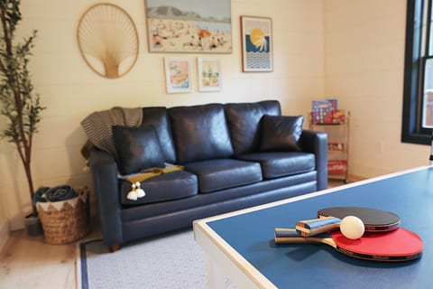 Entertaining room comes with darts, mini ping pong table and also an assortment of family friendly games.