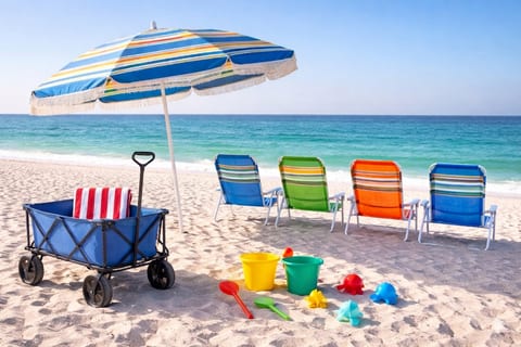Everything you need for the perfect beach day—chairs in the shade, toys in the sand, and the ocean just steps away ☀️