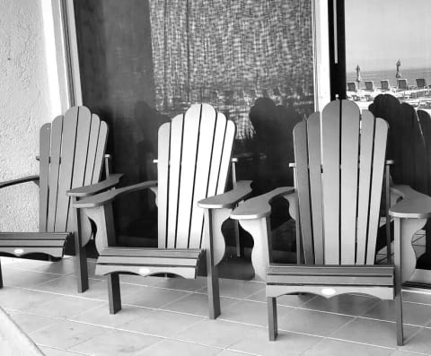 New Adirondack chairs on private patio. Great spot to sit and watch the kids play in the pool just a few steps from the condo!