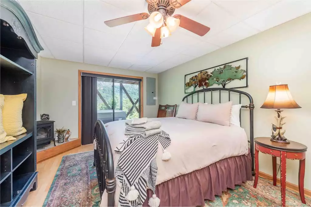 Downstairs. Semi-private Queen bedroom with slider to hot tub area