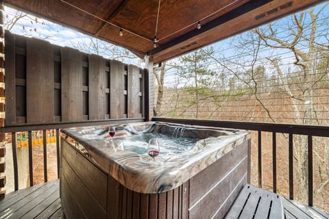 Hot tub on patio with access from great room and master