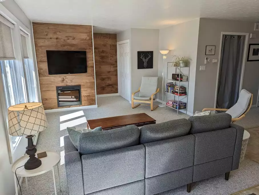 The living area is a large space that is open to the kitchen a dining areas. There is a large TV with an Amazon Firestick and a electric fireplace to keep you feeling cozy on cooler days. - Family Friendly Suite with Arcade and Park Pass - Prince Edward