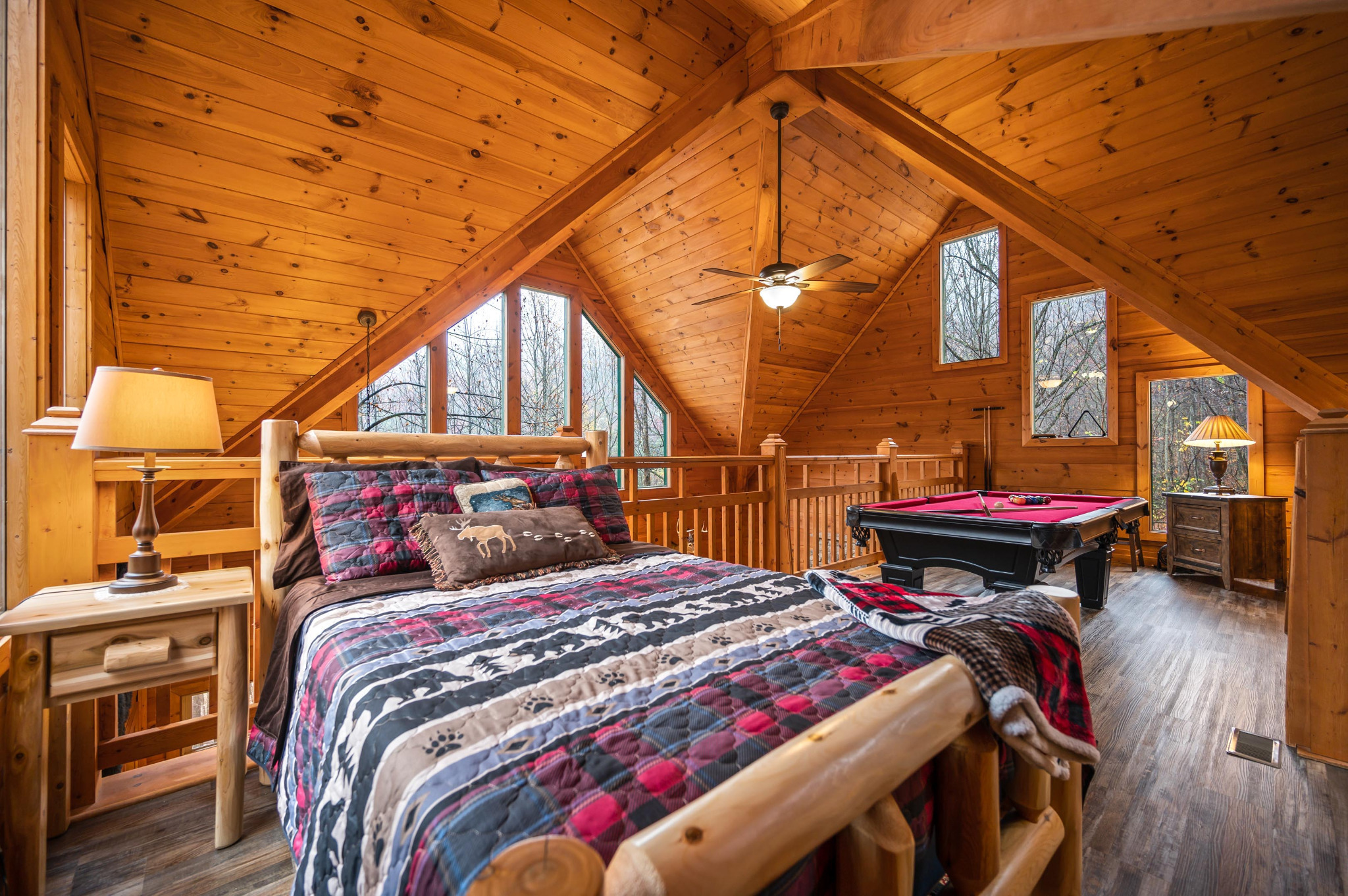 Open loft space, perfect for sleeping additional guests and star gazing!  Guests can see the stars through the cathedral windows that line this space.  Full size bed with dresser and extra blankets.