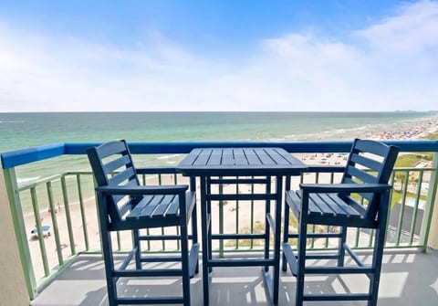The perfect place to sip your morning coffee or enjoy a meal. No railing to block the stunning view with the counter height dining table and chairs.