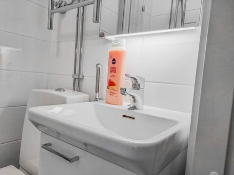 The bathroom is small and the materials are brand new. Shower gel, soap, shampoo & conditioner are included in your stay!