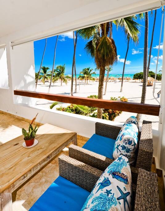 Lounge on your private patio while soaking up the beachfront view. - Luxury Condo with Stunning views, Private Beach - Punta Cana