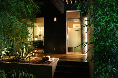 privately gated front door at night