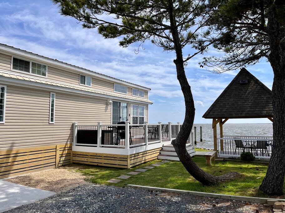 Parking for 2 vehicles, large wrap around deck and gazebo.