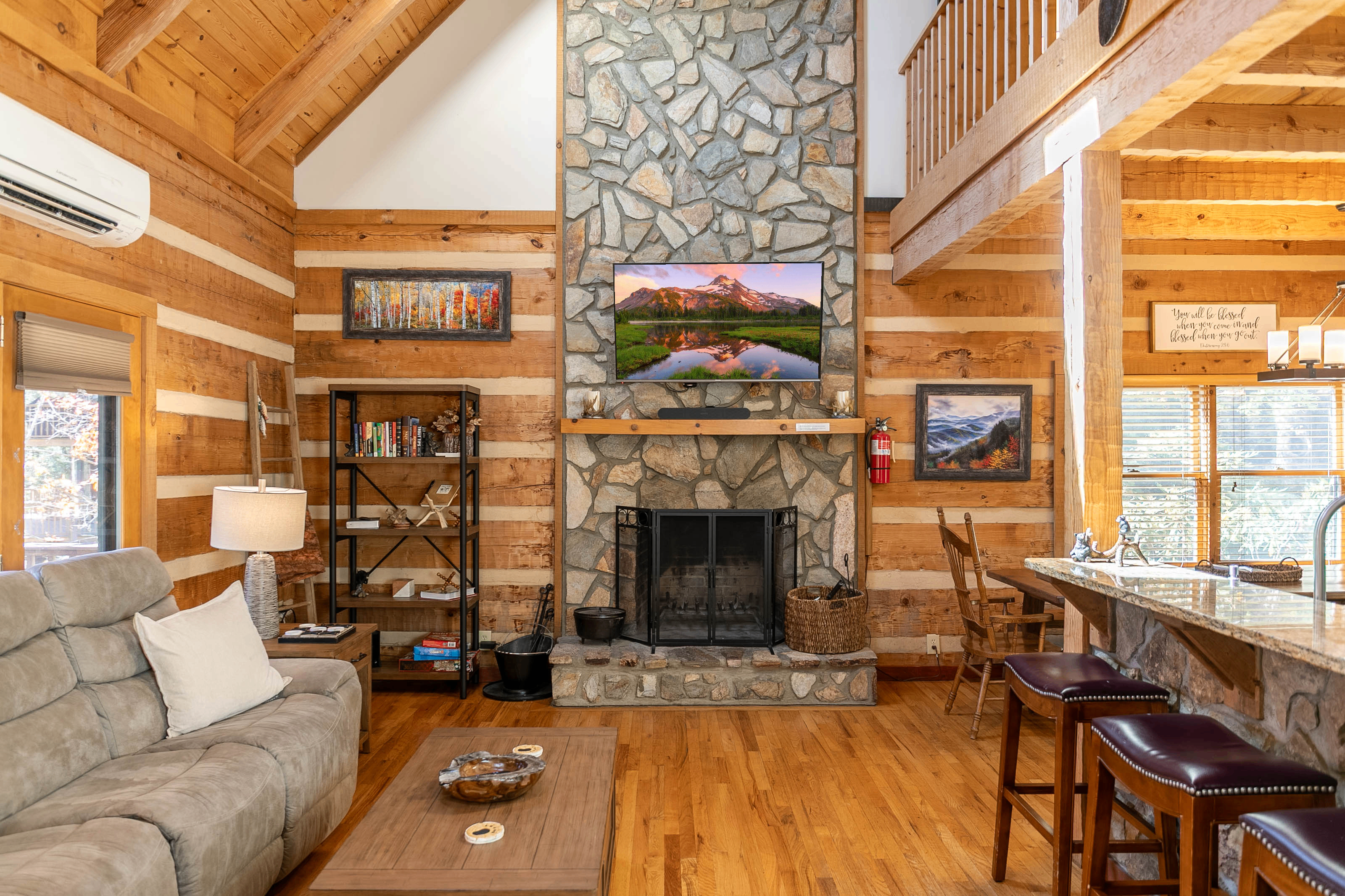 Main level common area Sectional has three recliners, family games are located in the coffee table, kitchen table seats eight, and four bar stools at the bar. Bookshelf has several classics ready to enjoy!