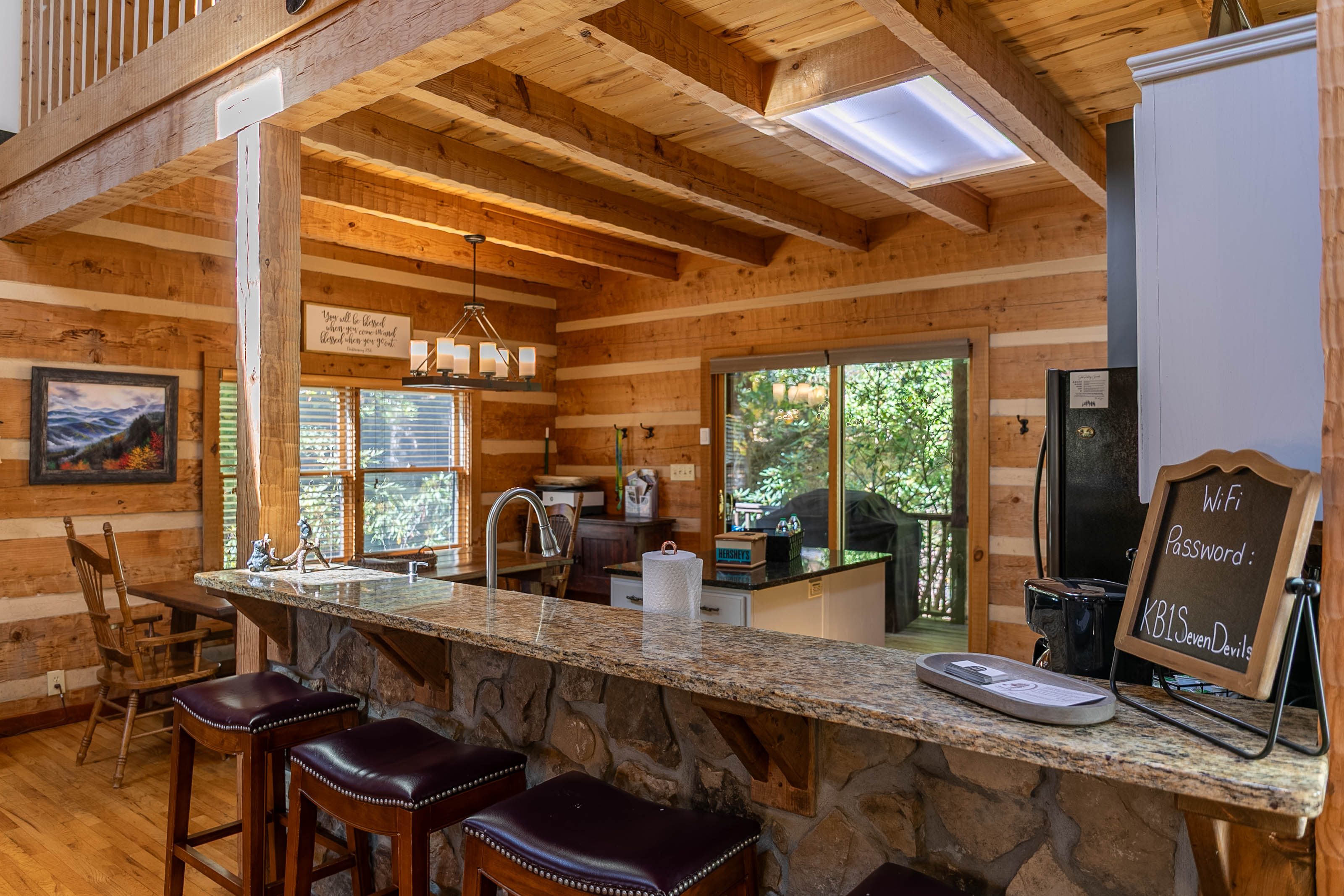 Kitchen area- table seats eight and bar has four bar stools