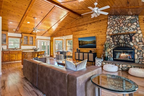 Cozy mountain getaway complete with a stone fireplace and natural furnishings.
