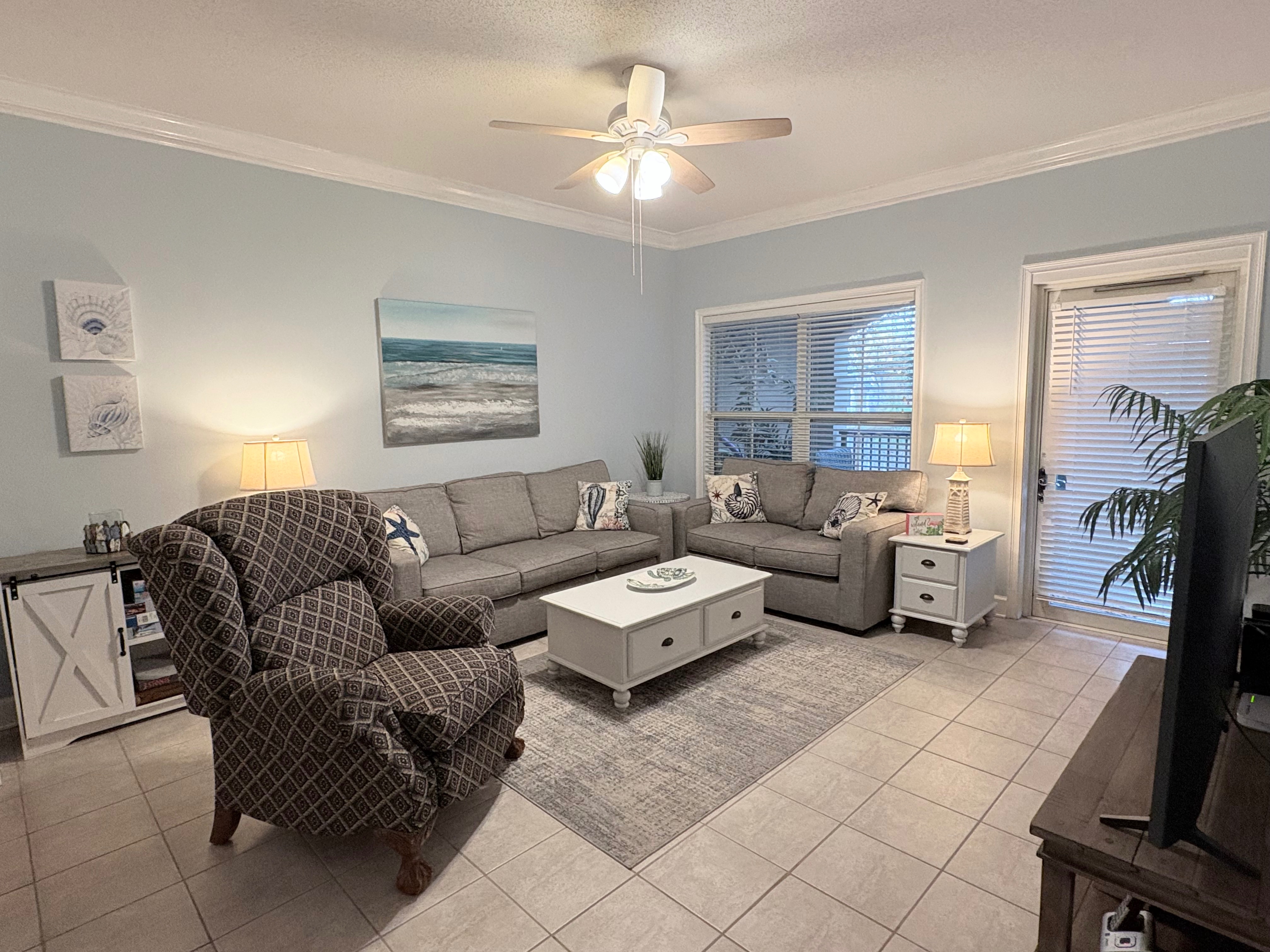 Living room complete with smart tv, comfy seating including large recliner. 