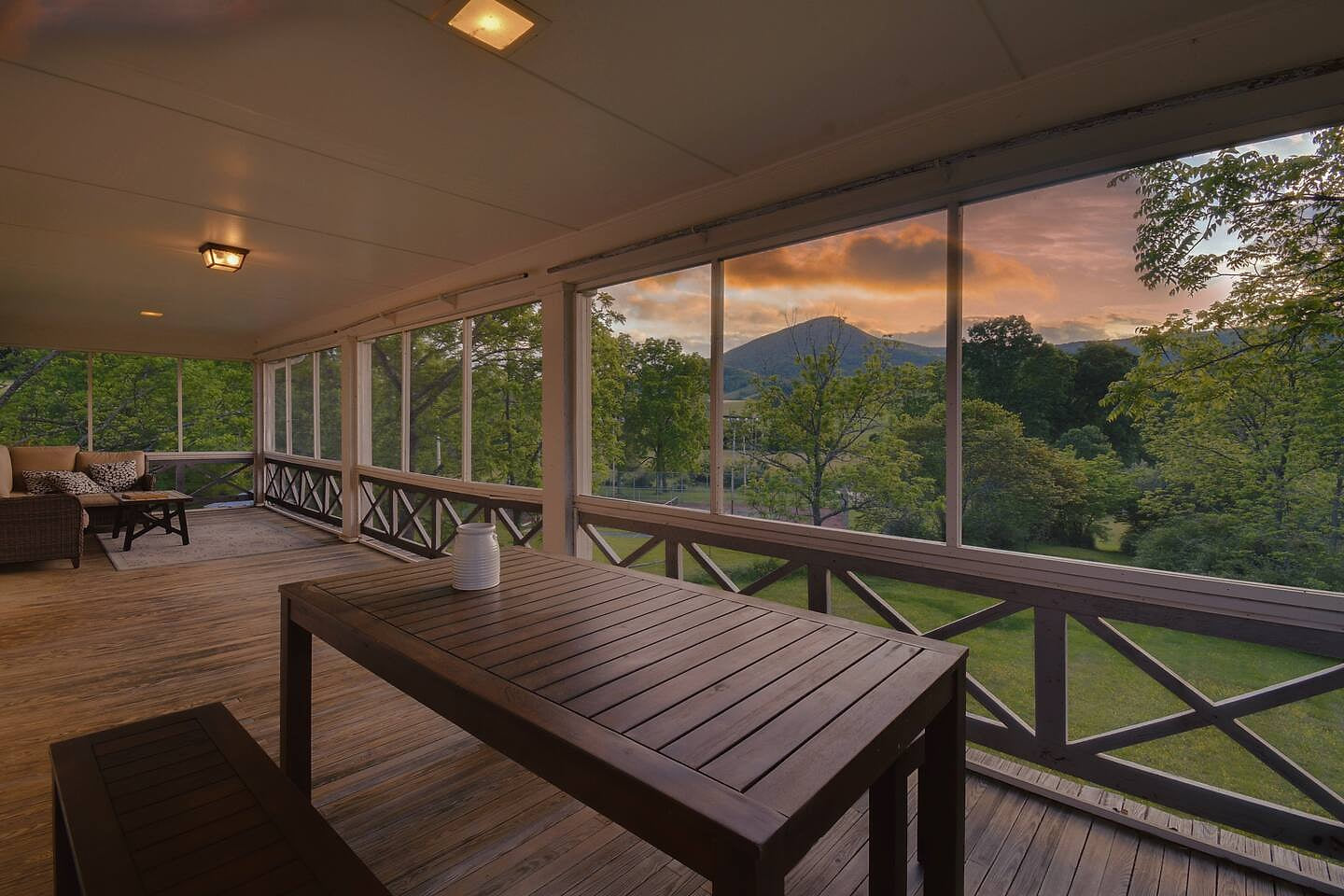 Screened balcony is perfect for relaxing while out on the farm and enjoying incredible views of Jump Mountain in the Shenadoah Mountains Historic Farm - Relax, Hike, & Fish! Pet Friendly