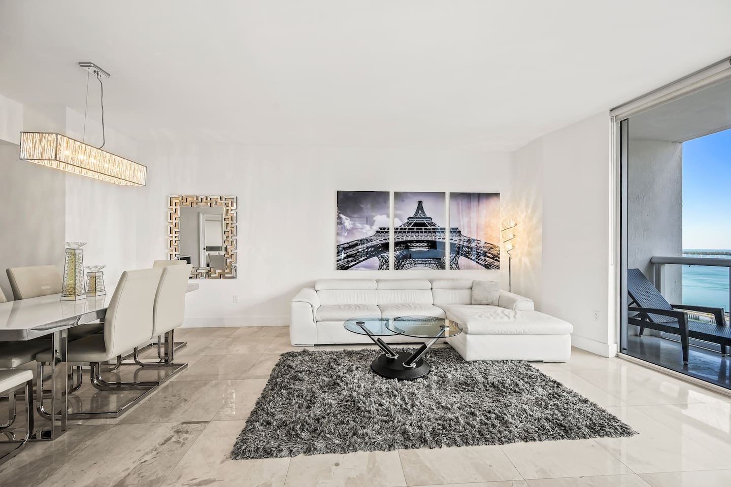 Dining table and living room with terrace/balcony