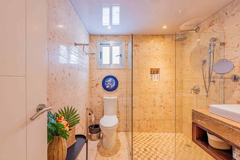 The master bathroom has a large shower, toiletries and double sinks. The Tipsy Turtle Hideaway also has a tankless water heater so everyone gets a hot shower!