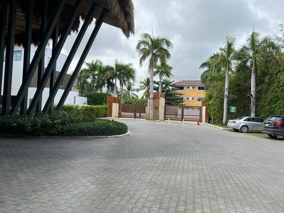 Inside the complex, facing the security gate - they will greet you coming and going!