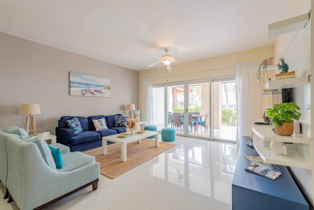Light and airy space with room to spread out! Beyond the sliding glass doors is the patio with dining and seating area, and straight out is the pool! The living room has a TV with wifi and movie channels, books and magazines, and some games.