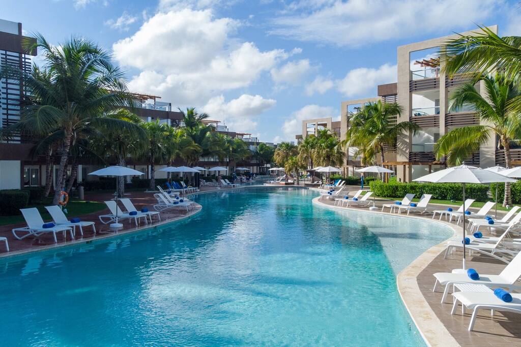 The pool has a sloped "beach" type entrance for kids, as well as several shallow ledges to relax on. The water never gets more than about 4' deep