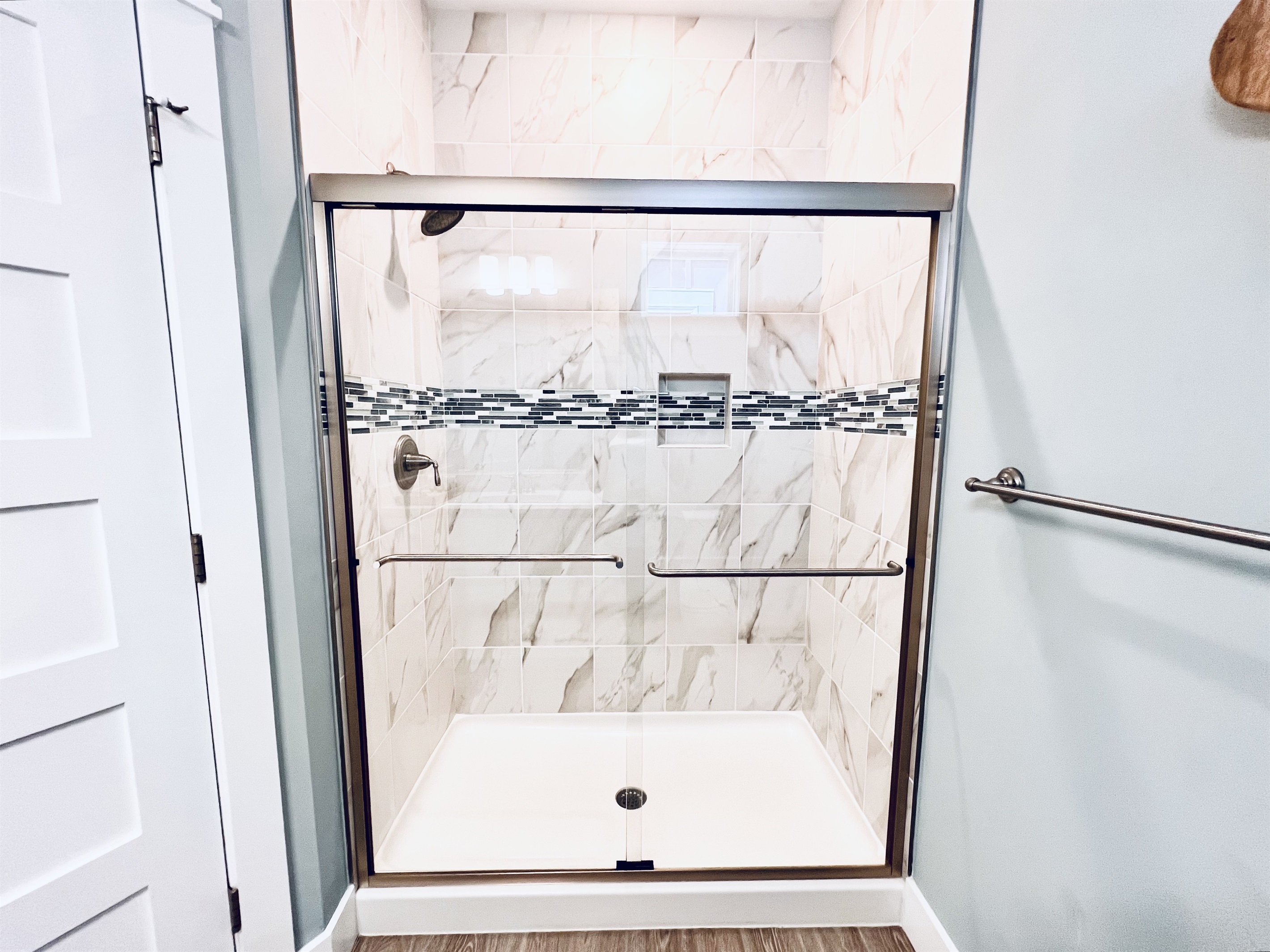 Elegance knows no bounds in this stunning, white bathroom retreat