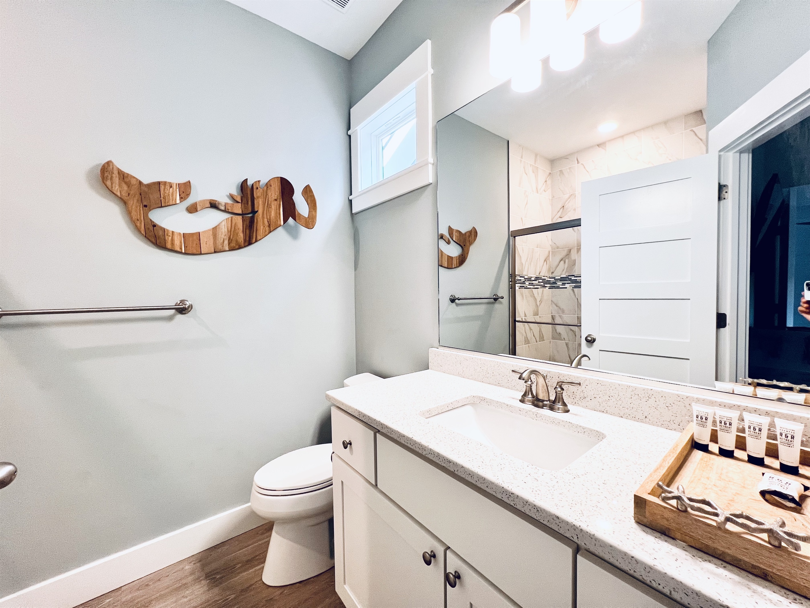 Start and end your day in style with this elegant, all-white bathroom.