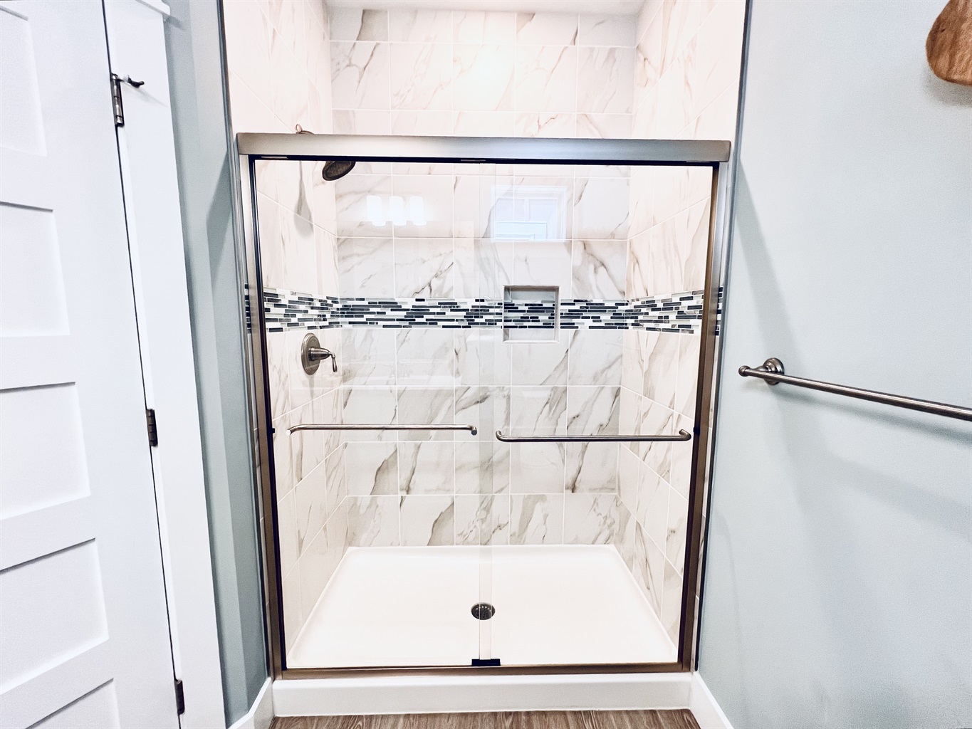 Elegance knows no bounds in this stunning, white bathroom retreat