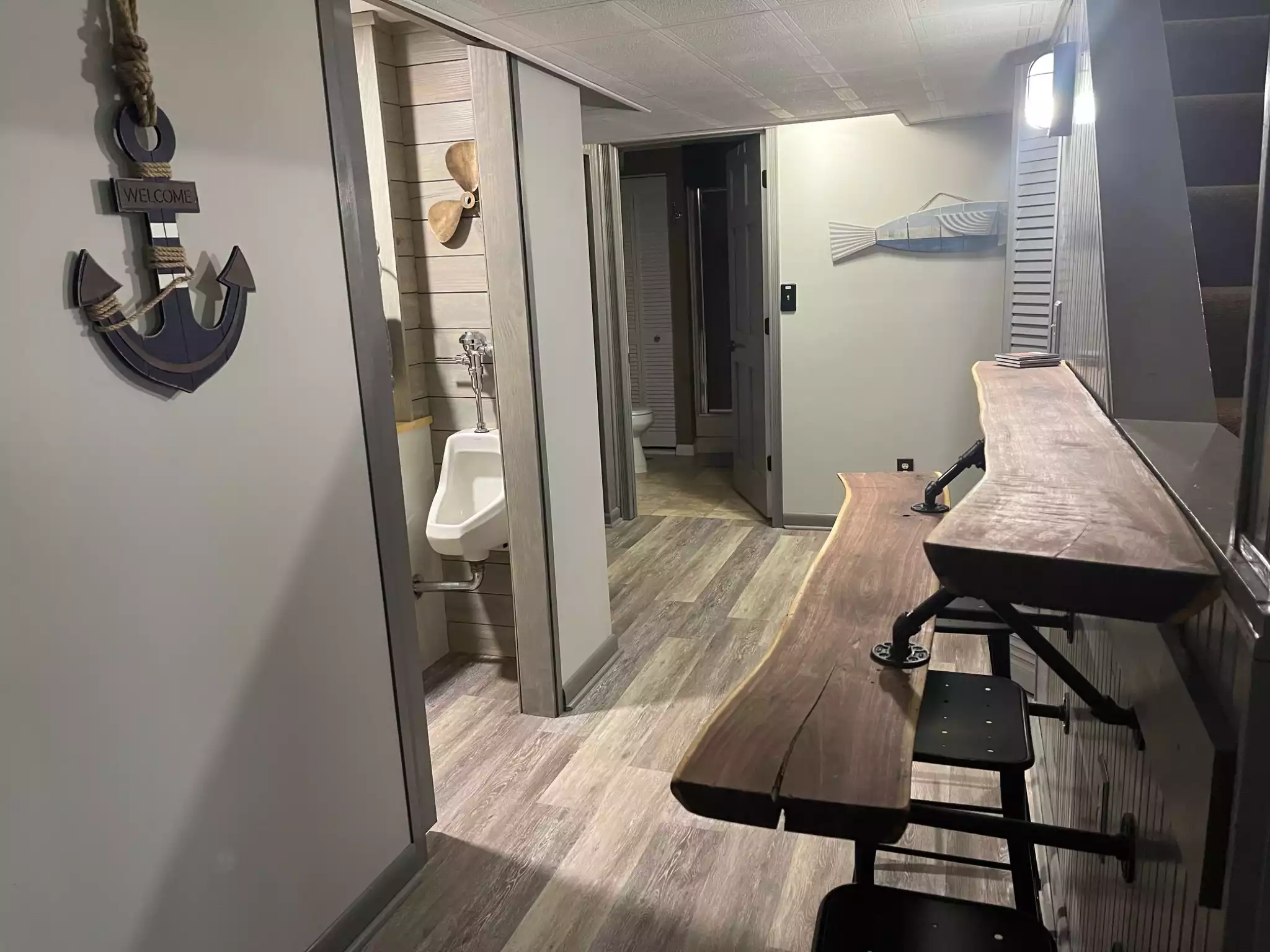 Basement hallway with bar and view of the tv - Buschwood Boat Club-Norris Lake @Springs Dock - LaFollette