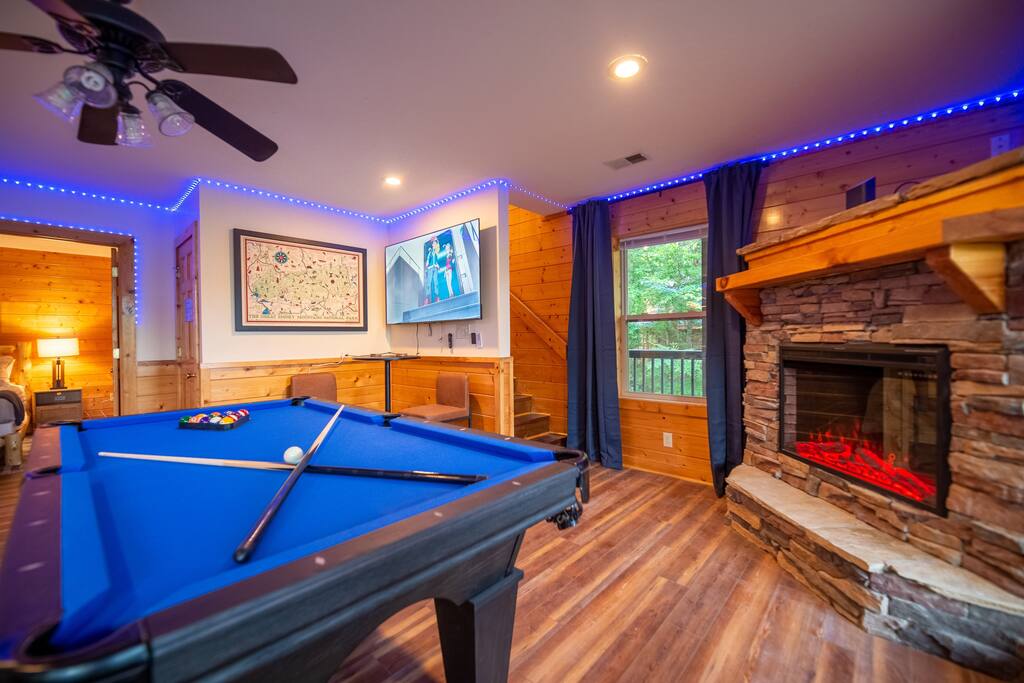 Game room with Pool Table, TV, Fireplace, Bar table and chairs
