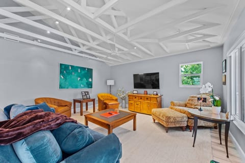 Go to the beach from expansive heated pool home