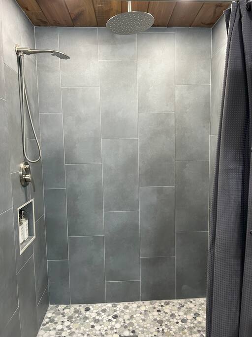 walk-in tiled shower in tiny home near Deep Creek walk-in tiled shower in tiny home near Deep Creek - Cozy Retreat + Hot Tub + Near Town/Train/Breweries - 28713