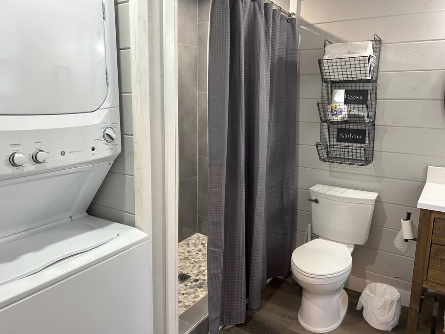 full bathroom with walk-in tiled shower and full size washer and dryer full bathroom with walk-in tiled shower and full size washer and dryer - Cozy Retreat + Hot Tub + Near Town/Train/Breweries - 28713