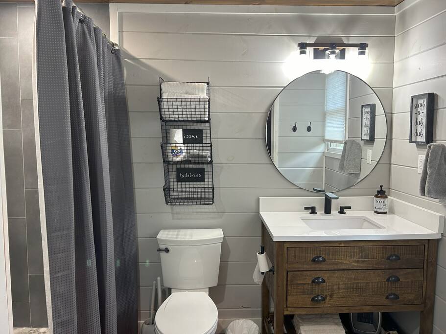 full bathroom with walk-in tiled shower and full size washer and full size dryer full bathroom with walk-in tiled shower and full size washer and full size dryer - Cozy Retreat + Hot Tub + Near Town/Train/Breweries - 28713