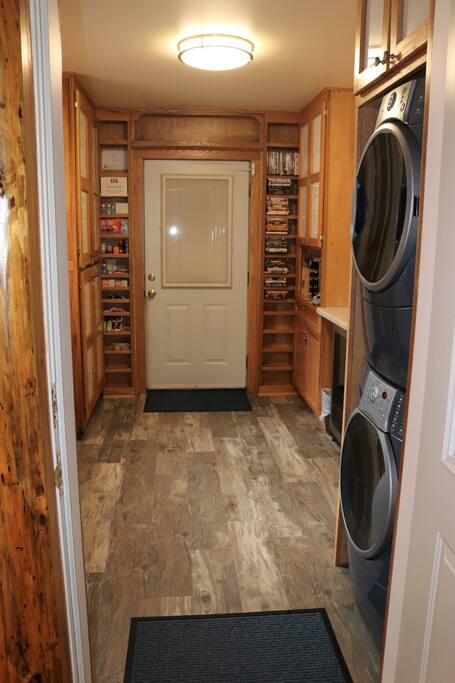 shared laundry area has washer/dryer, dvd library, small honor store, and available games and puzzles. Garage door leads to freezer for packaged fish.