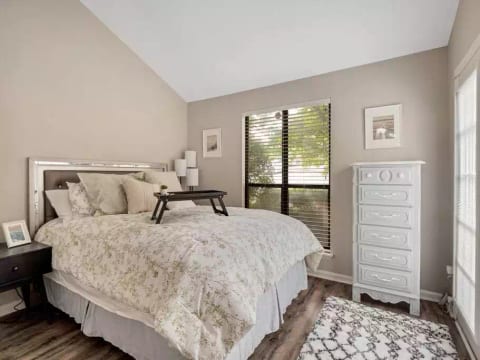Guest bedroom #2 (downstairs) featuring queen sized euro-hybrid mattress, two closets. Small private patio located through French doors. Shares downstairs bathroom that has tub/shower combo.