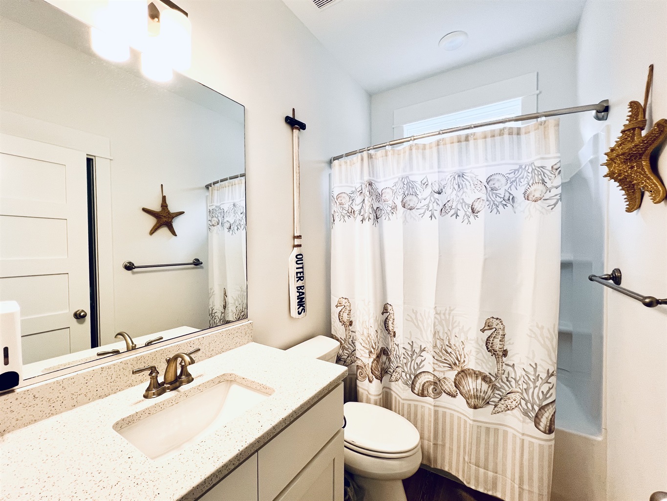 Elegance knows no bounds in this stunning, white bathroom retreat.