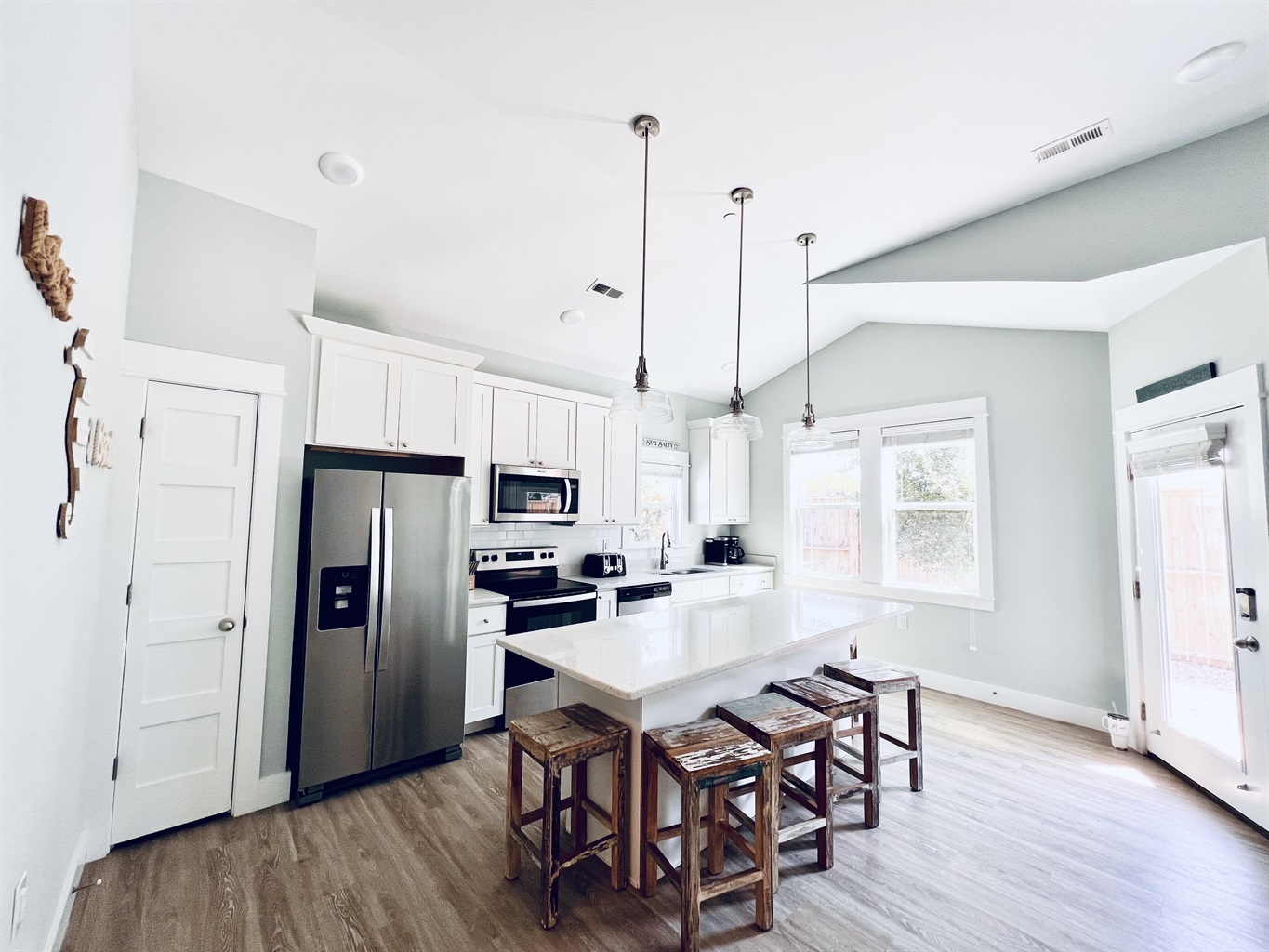 Create culinary magic in this beautifully stocked, white-themed kitchen.