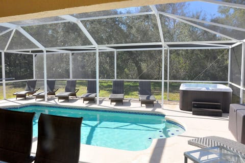 Your wonderful pool & hot tub. Catch some Florida sun in comfortable loungers!