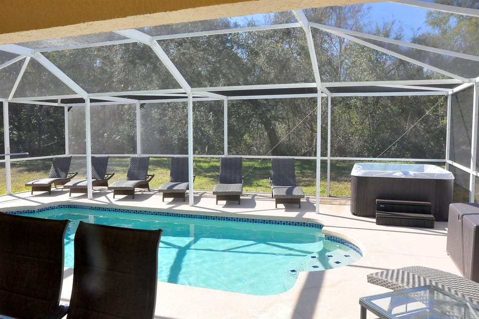Your wonderful pool & hot tub. Catch some Florida sun in comfortable loungers!