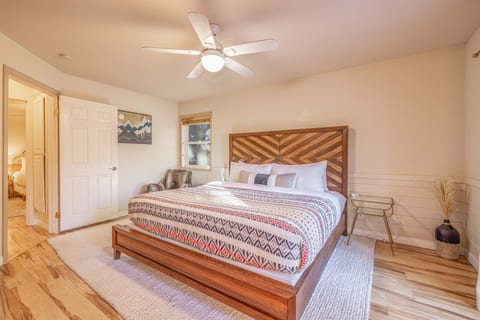 King master bedroom with en-suire bathroom and patio access