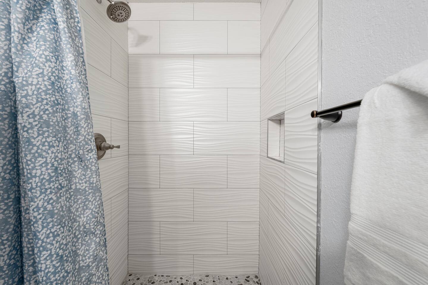 Shower area in the downstairs bathroom
