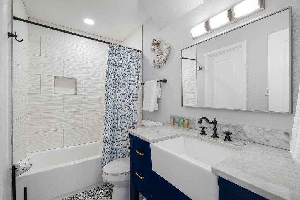 Upstairs full-size bathroom.  It has two doors. One is connected to the king-size bedroom, and another door is accessible through hallway